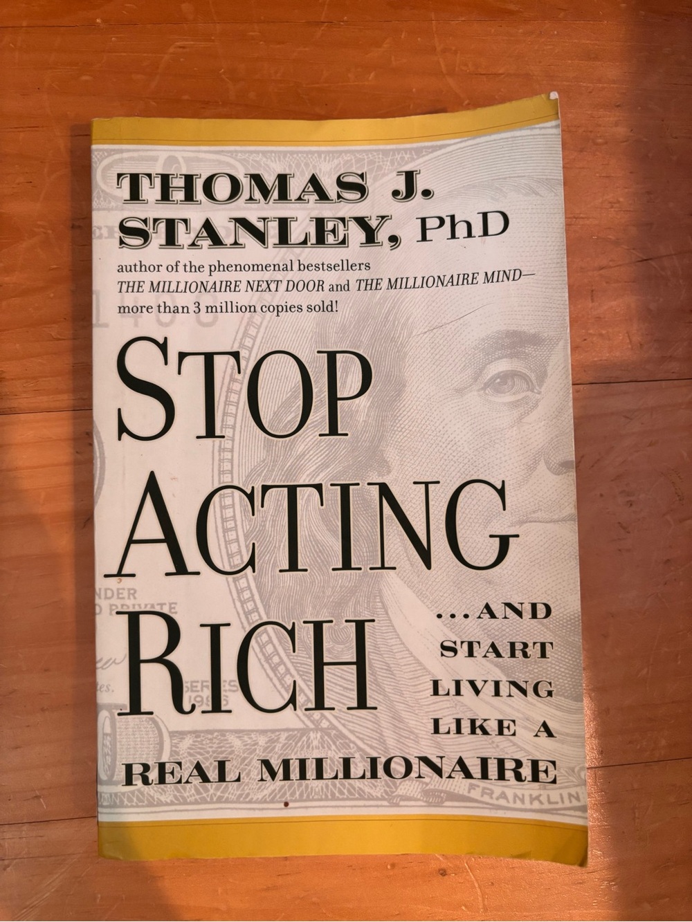 Thomas J. Stanley Stop Acting Rich Book - Yellow and White